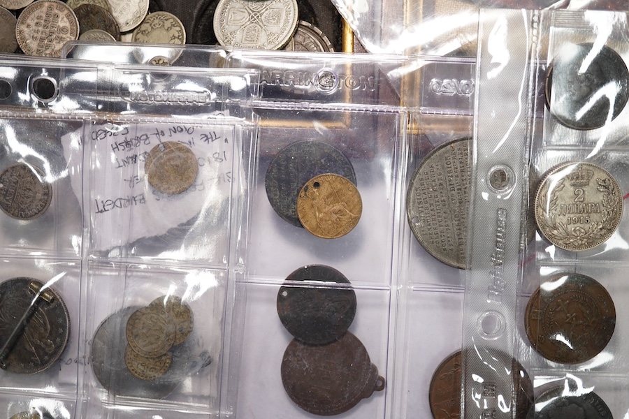 A collection of silver coins mounted as jewellery, pierced coins, commemorative medals, tokens and various coin wallets and sovereign scales